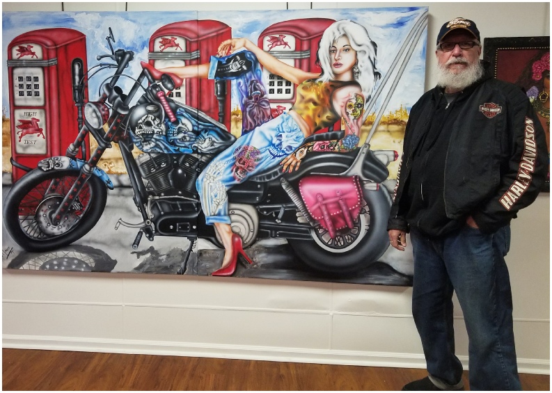 Jon Lange with one of his paintings